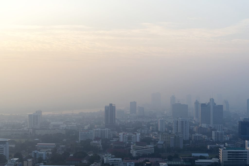 City skyline covered by haze with reduced visibility due to air pollution